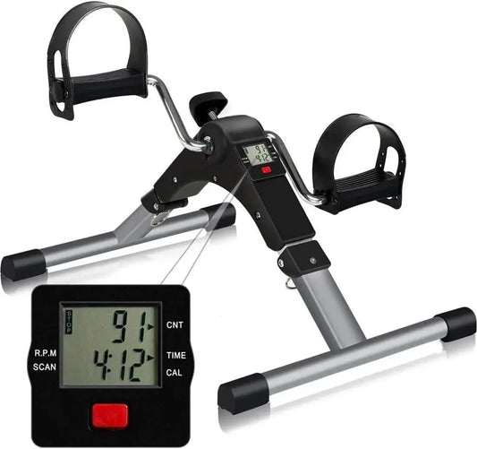 A portable mini exercise bike pedal exerciser featuring a prominent digital performance monitor.