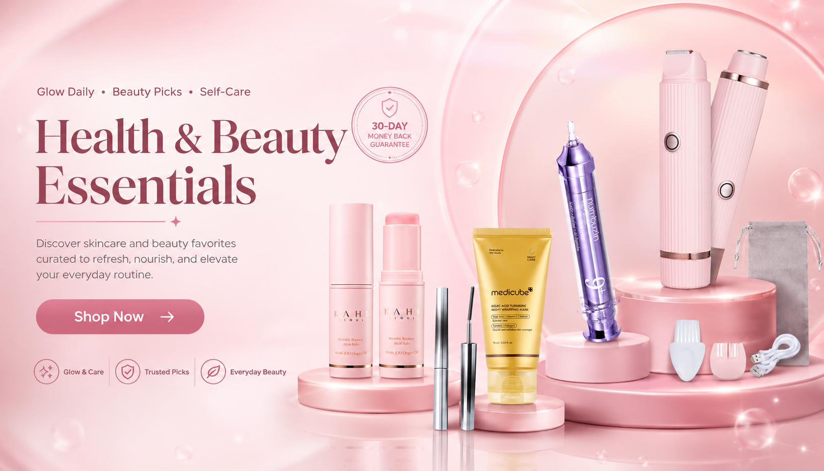 A pink promotional banner for beauty and skincare essentials, featuring several cosmetic products arranged on pink pedestals against a soft pink background. Visible items include a yellow tube, a purple device, and several white and silver bottles and tools.